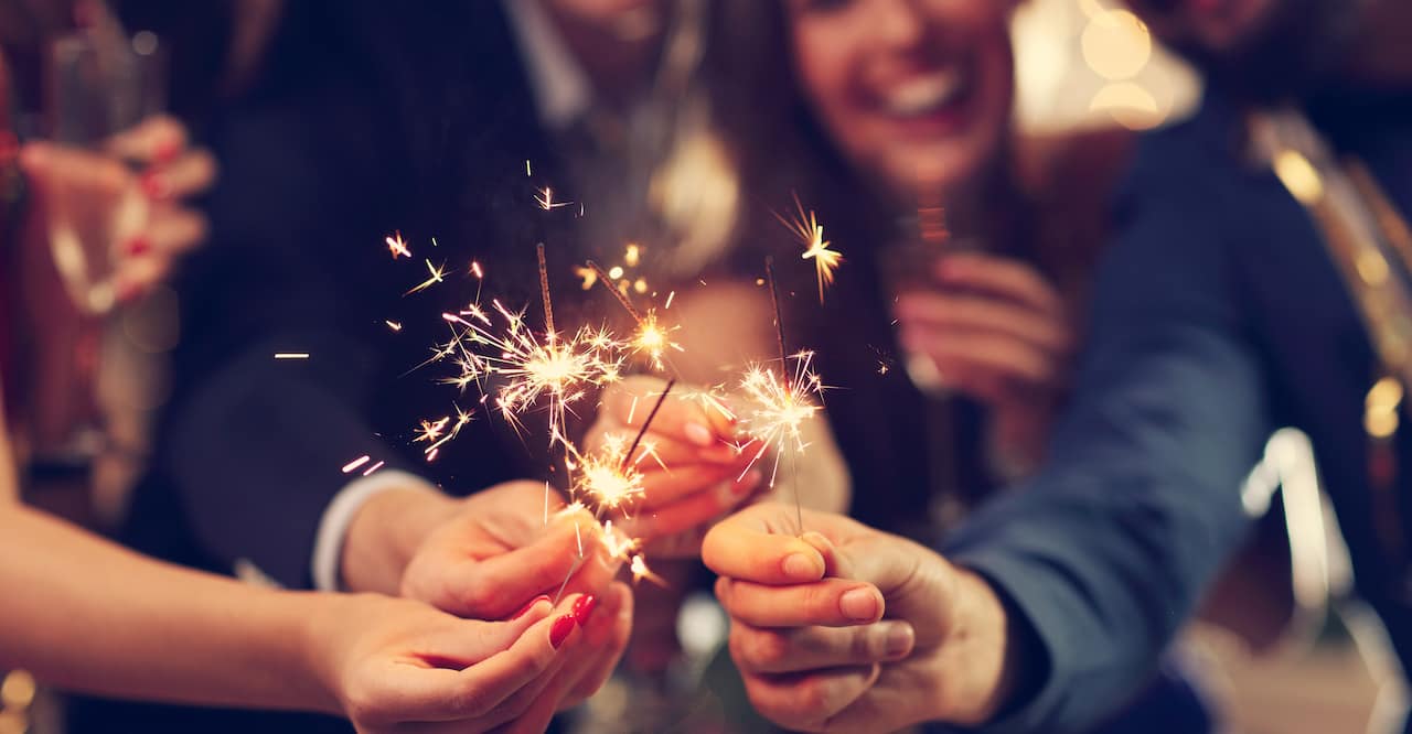 Party goers with sparklers